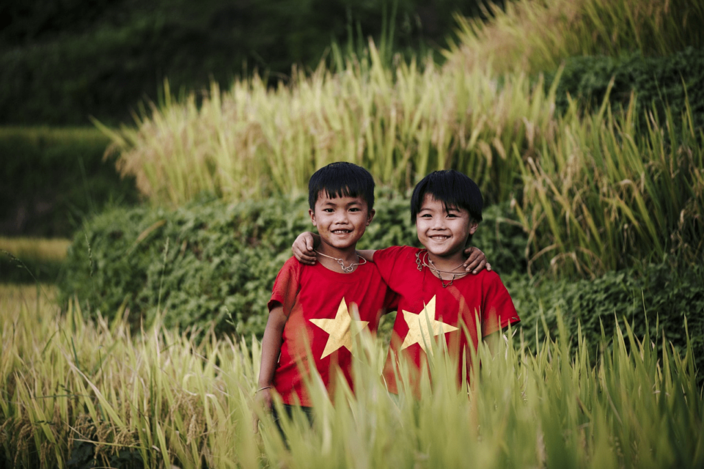 A kids standing next to each other in vietnam