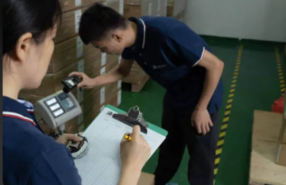 workers performing quality assurance and textile production in garment factory