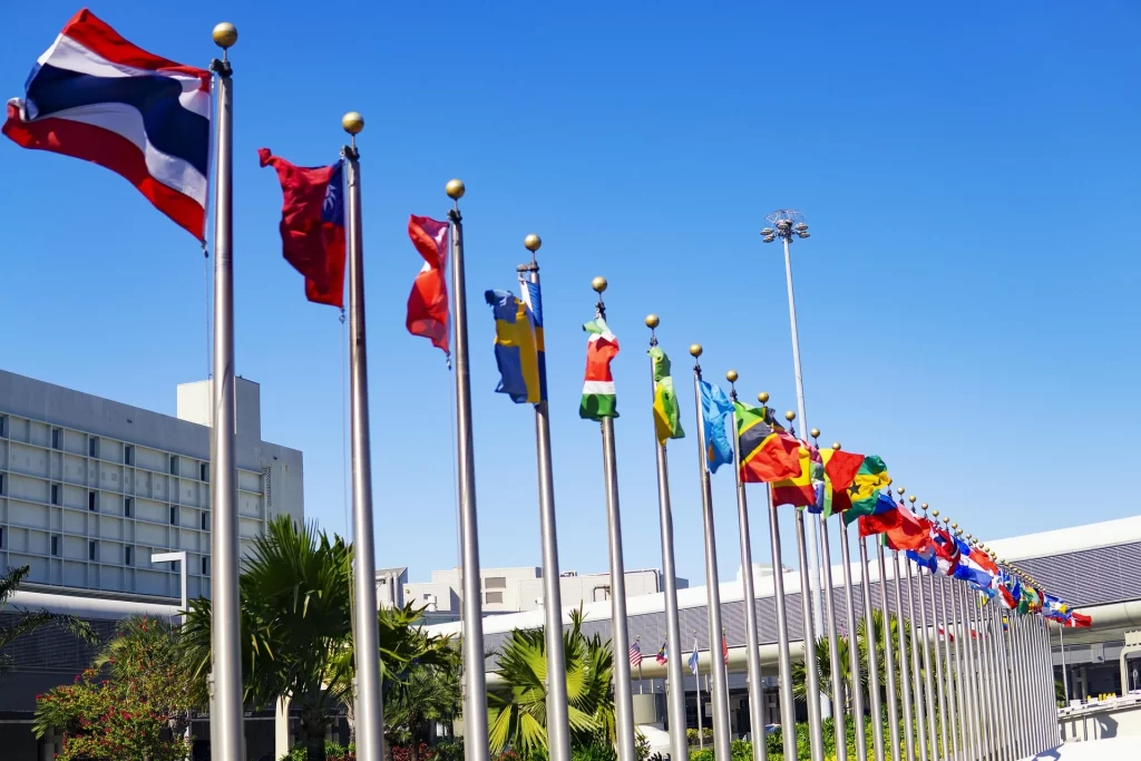 International flags representing global sourcing markets, international trade and supply chain diversification.