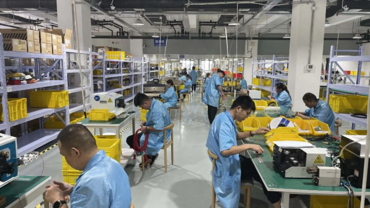 Factory workers carrying out quality control during mass production to prevent quality defects.